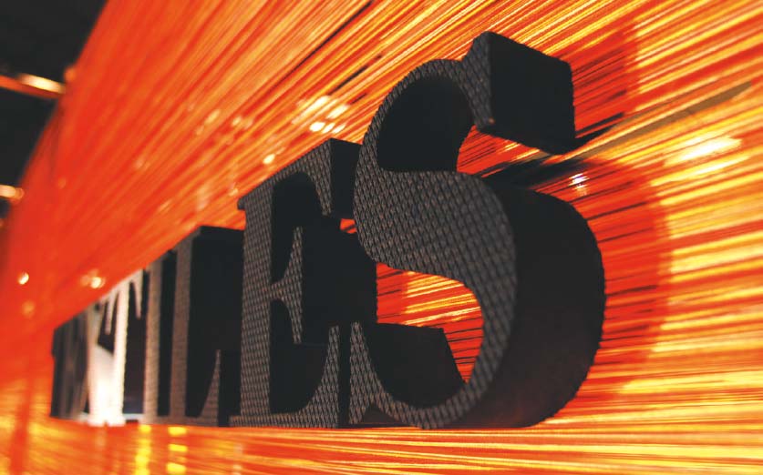 Textiles Marketing exhibition stand design - logo sign
